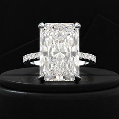 Embrace magnificence with our HUGE 9 Carat Radiant Cut Diamond Engagement Ring. Featuring a lab grown diamond pave band, this ring is perfect for weddings, proposals, and luxury anniversary gifts. Crafted with exquisite detail and elegance, it embodies timeless beauty and sophistication. Make a statement of enduring love with this stunning piece from Lux By Evara Jewelry. 𝐅𝐞𝐚𝐭𝐮𝐫𝐞𝐬:• 𝐌𝐚𝐝𝐞 𝐭𝐨 𝐎𝐫𝐝𝐞𝐫• 𝐌𝐞𝐭𝐚𝐥: 𝟏𝟒𝐊 𝐆𝐨𝐥𝐝 | 𝟏𝟖𝐊 𝐆𝐨𝐥𝐝 | 𝟗𝟓𝟎 𝐏𝐥𝐚𝐭𝐢𝐧𝐮𝐦• 𝐁𝐚𝐧? Huge Engagement Rings, Radiant Cut Diamond Engagement Rings, Stacked Wedding Rings, Pave Diamond Band, Emerald Engagement Ring Cut, Pave Band, Radiant Cut Diamond, Emerald Engagement, Engagement Ring Cuts