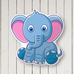 an elephant sticker is shown on a white wooden surface with planks in the background