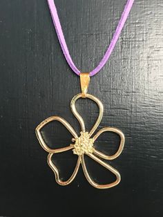 Gold plated Large Flower Pendant on a suede cord Necklace. The Flower Pendant is 42mm x 37mm and comes on a choice of colour suede cord which is 2mm in width and is adjustable using the gold plated extender chain Necklace. This is a very stylish, easy to wear light Pendant necklace which will go with any outfit.  Each Necklace is made to order and available in 4 lenghts and in 10 colours: Length of cord (not including the extendable chain): 16 inch 18 inch 20inch 22inch Colour Suede available: Black Turquoise Royal Blue Red Brown Purple Peach White Grey Green Please choose at checkout the length and colour you require. Each necklace is presented in a cardboard Jewellery box. FREE POSTAGE (Second Class) within the UK. Upgrade to First class post for an additional cost and International post Gold Nickel-free Flower Pendant Necklace, Adjustable Gold Flower Necklace As Gift, Adjustable Gold Flower Necklace For Gift, Handmade Gold Flower Necklace, Suede Cord Necklace, Necklace Wood, Cardboard Jewelry Boxes, Bead Choker, Necklace Flower