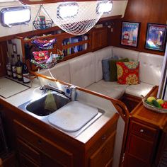 there is a sink in the corner of this boat that has been converted into a living area