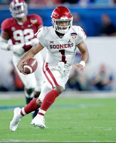 a football player is running with the ball