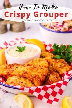 crispy chicken is served in a basket with lemon wedges