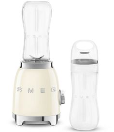 an electric blender next to a plastic container on a white background with the words smeg written on it