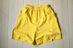 Beautiful summer shorts with two side pockets. Seems like at least partly made of linen, although can't say it for sure, because there is no information about the fabric. Vintage condition on a scale 1-10 is 9 MADE IN U.S.A. Size : marked size (12); seems like women's (M/L) PLEASE CHECK ALL MEASUREMENTS BELLOW: Length: 50 cm / 19.5" Waist: 66-90 cm / 26-35.5" Hips: 120 cm / 47" Inseam: 16 cm / 6.5" Fabric: cotton, linen Brand: Catalina FIND MORE SHORTS AND PANTS HERE: https://www.etsy.com/shop/T High Waist Cotton Bermuda Shorts For Beach, High Waist Cotton Bermuda Shorts For Summer, Summer High-waisted Bermuda Shorts With Elastic Waistband, High-waisted Bermuda Shorts With Elastic Waistband For Summer, Summer Bermuda Shorts With Pockets For Beach, Summer Beach Bermuda Shorts With Pockets, High-waisted Summer Shorts With Side Pockets, Loosely Fitted Beach Shorts With Pockets, High-waisted Cotton Bermuda Shorts For Beach