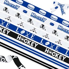 the hockey ribbon is blue and white with black lettering on it, along with two different types of stickers