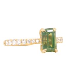 Give your style a sparkle with our Classic Prong Hidden Halo Sapphire solitaire with French Set diamond band. A 1.67ct emerald cut, opalescent green sapphire is at its center, measuring around 8x5mm. Its unique profile elevates your style and makes it easy to mix and match with similar bands. Crafted from recycled 18k yellow gold and decorated with delicate tapered, natural diamonds from 1.3mm to 2mm in size, this beauty will make a statement. Finish off your look with either a classic polished Luxury Radiant Cut May Birthstone Jewelry, Green Moissanite Jewelry In Radiant Cut, Green Moissanite Radiant Cut Jewelry, Green Moissanite Jewelry With Radiant Cut, Green Radiant Cut Moissanite Jewelry, Green Jewelry With Radiant Cut Accent Stones, Green Asscher Cut Moissanite Jewelry, Green Baguette Cut Jewelry With Accent Stones, Green Emerald Cut Diamond Gemstones