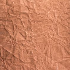 an old brown paper textured with lines and scratches on the surface is shown in this image