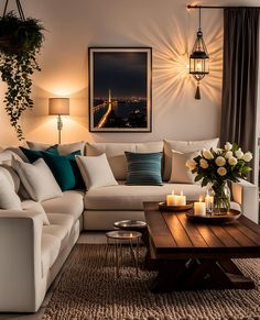 a living room filled with lots of furniture and flowers on top of a coffee table