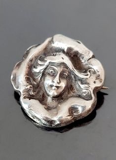 "Fabulous Art Nouveau sterling silver pin by William Link circa 1902. This piece is marked on the reverse, copyrighted 1902 by Wm.Link sterling.  William Link Co was in business in Newark, NJ, from 1871 to 1931. Throughout their history the company maintained a high standard of design and workmanship and was well known for their beautiful Nouveau period pieces. She's in very good condition with some age appropriate wear.   I have very lightly polished just the high points on this piece to highli Art Nouveau Brooch Jewelry For Anniversary, Silver Art Nouveau Brooches As Gift, Silver Art Nouveau Brooches For Gifts, Art Nouveau Sterling Silver Pendant, Luxury Art Nouveau Cabochon Brooch, Collectible Art Nouveau Hallmarked Brooch, Silver Art Nouveau Brooch, Period Pieces, Newark Nj