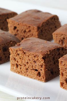 several pieces of brownie on a white plate