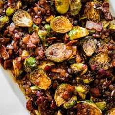 roasted brussel sprouts and brussels sprouts in a white casserole dish