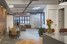 an industrial style living room and dining area