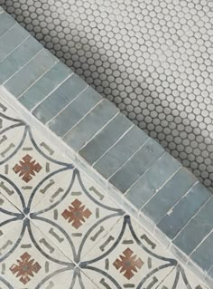 an umbrella sitting on top of a tiled floor