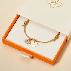 For a wish of luck and love, give our Personalized Clover Bracelet as a thoughtful keepsake to cherish. Personalize this bracelet with a special name or heartfelt word to create a keepsake full of meaning.&nbsp;18K Champagne Gold PlatedMini flat disc: 0.4 Diameter, 0.02 ThicknessClover Charm: 0.35Braid made of a durable, colorfast polyesterFully adjustable sliding knot fasteningHand-engraved in our Paris workshopSent with love in a complimentary gift boxAny slight variations in lettering depth, spacing and alignment from the examples shown are part of the aesthetic and originality of the piece Adjustable Rose Gold Promise Bracelet, Yellow Gold Bracelets For Friendship And Mother's Day, Friendship 14k Rose Gold Jewelry, Yellow Gold Bracelets For Friendship On Mother's Day, Yellow Gold Bracelets For Mother's Day And Friendship, Rose Gold 14k Friendship Jewelry, 14k Rose Gold Jewelry For Friendship, Adjustable 14k Gold Jubilee Charm Bracelet, Gold Charm Bracelet Gift