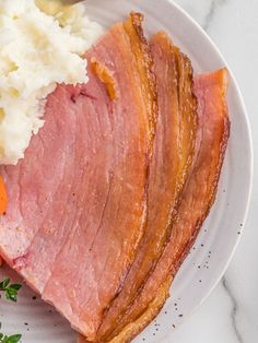 ham, mashed potatoes and carrots on a plate