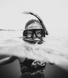 a person in the water wearing a diving mask