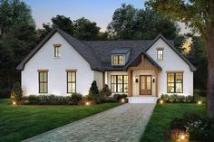 this is an artist's rendering of the front elevation of these modern farmhouse house plans