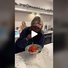 a woman is cutting up some food on a plate