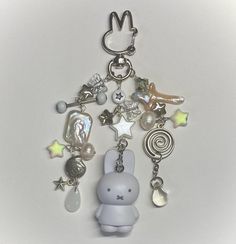 a keychain with an animal charm attached to it's front and back ends