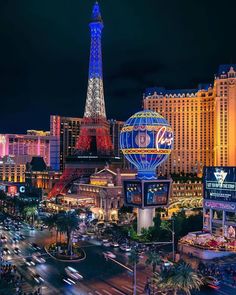 the eiffel tower is lit up at night in las vegas, nv