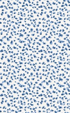 a blue and white animal print pattern with spots on the surface, as well as dots