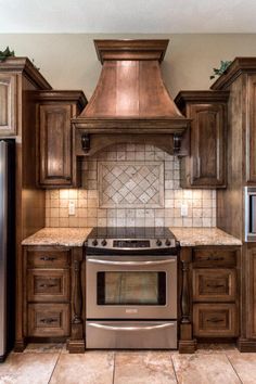 a stove top oven sitting inside of a kitchen next to wooden cupboards and cabinets