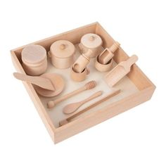 wooden toy kitchen set with utensils and spoons in tray on white background