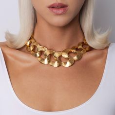 The Penelope Necklace is all about making a statement. Featuring a bold, oversized link chain from the original 60s-90s era, this piece infuses a powerful historic vibe into modern fashion. Its striking design guarantees a big impact and ensures you stand out with effortless style. * 18ct gold-plated necklace * 45cm length  * Link fastening  * Hand made in UK * Avoid contact with make-up and chemical cleaning products * Plating and lengths may vary as all products are handmade using vintage chai 90s Era, Gold Plated Necklace, Cleaning Products, Modern Fashion, Link Chain, Effortless Style, Favorite Jewelry, Halloween Shopping, Charm Necklace