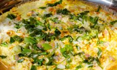 an omelet with green onions and other toppings