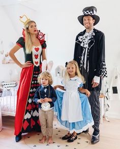 a man and two children dressed up in costumes