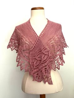 "This luxuriously soft handknit pink lace shawlette is made of hand dyed merino wool.  The Swans Island yarn is handcrafted in Maine of 100% organic merino wool, hand dyed with all natural dyes.  The variegation in the yarn is unique to the hand dyeing process.    This small shawl or shawlette is perfect for taking the chill off during all four seasons, from use as a wedding shawl to a neck wrap for a touch of beauty.   The shawl's lace pattern which has leaves, a small cable and a leafy edge ar Pink Crochet Lace Shawl In Bohemian Style, Bohemian Pink Shawl With Crochet Lace, Pink Bohemian Shawl With Crochet Lace, Pink Crochet Shawl One Size, Pink Crochet Shawl, Pink Shawl, Hand Knit Shawl, Black Shawl, Merino Wool Scarf