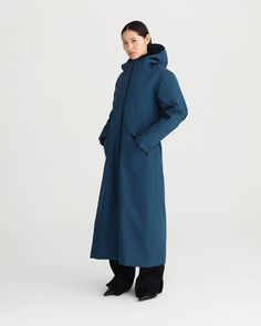 SPIRIT offers a distinctive look, alongside protection, empowering and complementing a woman’s shape. It is a long all-weather coat with recycled detachable liner. DESCRIPTIONA 3-in-1 raincoat, the recycled polyester lining performs as a standalone coat in itself.The outer coat alone makes for the perfect waterproof mid-season and summer protection.Both coats combined offer the perfect all-weather protection.Falling just above the ankles, the hem can be cinched to create the perfect silhouette.T Raincoat Outfit, Ethical Clothing Brands, Long Winter Coats, Waterproof Coat, Blue Rain, Woman Silhouette, Ethical Clothing, Rain Wear, Coat Fashion