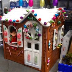 a gingerbread house is decorated with candy and candies