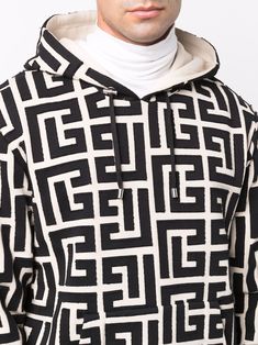 Black/white cotton monogram-print hoodie from Balmain featuring monogram print, drawstring hood, elasticated cuffs and elasticated hem. | Balmain Monogram-Print Hoodie Cut Hoodie, Balmain Men, Monogram Prints, Leather Cap, Printed Drawstring, Designer Clothes For Men, Cotton Hoodie, Denim Pant, Hoodie Print