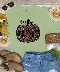 This leopard pumpkin tee will be your go to shirt this fall! Perfect for dressing up or down, you can wear this to any fall festivity throughout the season! Pair with a cardigan and booties for a stylish look this fall!

* 6 oz., 100% preshrunk cotton * Classic fit * Seamless double needle 7/8" collar * Taped neck and shoulders * Double needle sleeve and bottom hems * Quarter-turned to eliminate center crease Pumpkin Graphic, Leopard Pumpkin, Dressing Up, Fall Festival, Graphic Shirt, Graphic Shirts, Dress Up, Festival, Collar