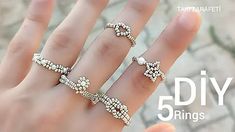 a woman's hand with five different rings on it and the words diy 5 rings