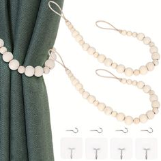 white beaded curtain tie backs with hooks on each side and two clips attached to them