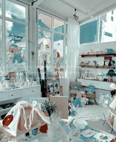 a room filled with lots of white and blue items