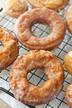 there are many donuts on the cooling rack