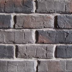 an old brick wall is shown in this image