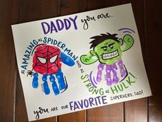 two handprints with the words daddy and spider - man on them are displayed next to each other