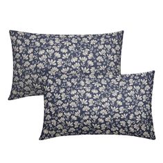 two blue and white pillows with floral print on them, one is made out of linen