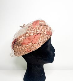 Lovely vintage taupe pillbox hat with a burnt umber ribbon woven throughout. This vintage hat is in a taupe/brown colour and woven from a synthetic material, interwoven in throughout the hat is a dark pink ribbon like material which gives it an interesting design. The interior of the hat has a soft velvet lining at the brim.   The hat also features a matching mesh with a velvet bow at the top. Unfortunately, the mesh has some damages. It seems there was some attempt to fix the mesh. I've NOTED T Veil Detail, Pill Box Hat, Hat With Veil, Box Hat, Burnt Umber, Interesting Design, Pillbox Hat, Vintage Hat, Brown Colour