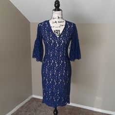 Nwt, V-Neck, Size Small, 3/4 Bell Sleeve. Blue Lace Over Beige Lining. Zipper Back And Eye Hook Closure. Fully Lined (Except Sleeves), Cotton/Nylon Blend Shell, 100% Polyester Lining. Length 36", Waist Approx 14" Flat, Pit To Pit Approx 16" Flat. Fitted Blue V-neck Dress For Date Night, Elegant Blue V-neck Dress For Date Night, Elegant Blue Dress With 3/4 Sleeves, Elegant Blue Knee-length V-neck Dress, Fitted Blue Scalloped Lace Dress, Blue Midi Dress With 3/4 Sleeves For Party, Blue 3/4 Sleeve Cocktail Dress, Elegant Royal Blue V-neck Midi Dress, Blue Lace V-neck Midi Dress