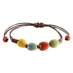 PRICES MAY VARY. VIBRANT HANDCRAFTED CERAMIC BEADS: Each bead on this bohemian bracelet is crafted from ceramic and uniquely colored, offering a vibrant spectrum from earthy greens to sunny yellows, making it a standout accessory. ADJUSTABLE LEATHER CORD: The robust leather cord is designed for longevity and comfort, featuring an adjustable knot that allows for a customized fit for any wrist size. PERFECT FOR LAYERING OR SOLO WEAR: Whether worn alone for a subtle hint of color or layered with ot Brown Friendship Bracelets With Colorful Beads For Beach, Beach Brown Friendship Bracelets With Colorful Beads, Bohemian Brown Bracelets For Vacation, Bohemian Brown Friendship Bracelets With Colorful Beads, Bohemian Brown Beaded Bracelets For Vacation, Bohemian Brown Beaded Bracelets With Sliding Knot, Bohemian Brown Beaded Bracelet With Sliding Knot, Colorful Bohemian Friendship Bracelets, Colorful Casual Jewelry For Festival