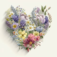 a heart - shaped arrangement of flowers on a white background is shown in this image