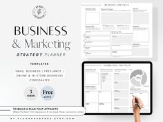 the business and marketing strategy planner is displayed on a computer screen, next to a person's hand holding a pen