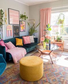 a living room filled with lots of furniture and flowers in vases on the wall