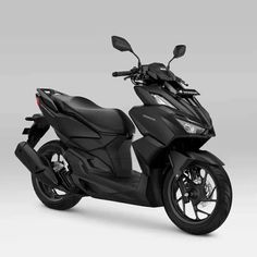 a black scooter is shown on a white background