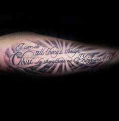 a man's arm with a quote on it